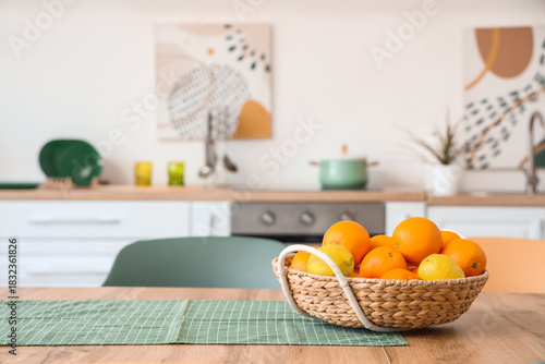 Wicker basket with lemons a...