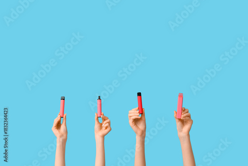 Many hands holding electron...