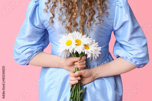 Young woman with bouquet of...