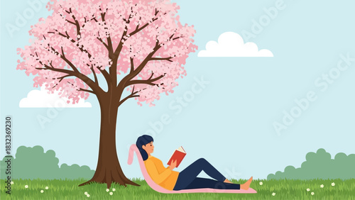 A person is relaxing and reading a book under a blossoming cherry tree in a park on a sunny day.