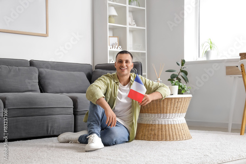Young man with flag of Fran...