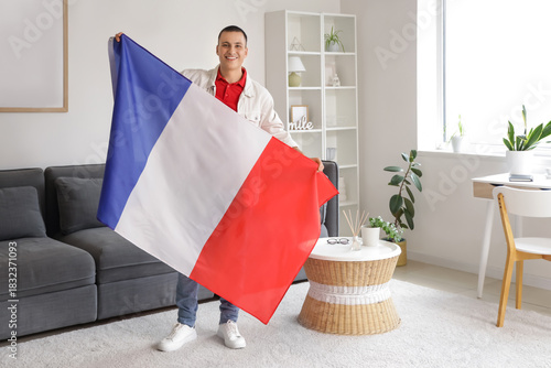 Young man with flag of Fran...