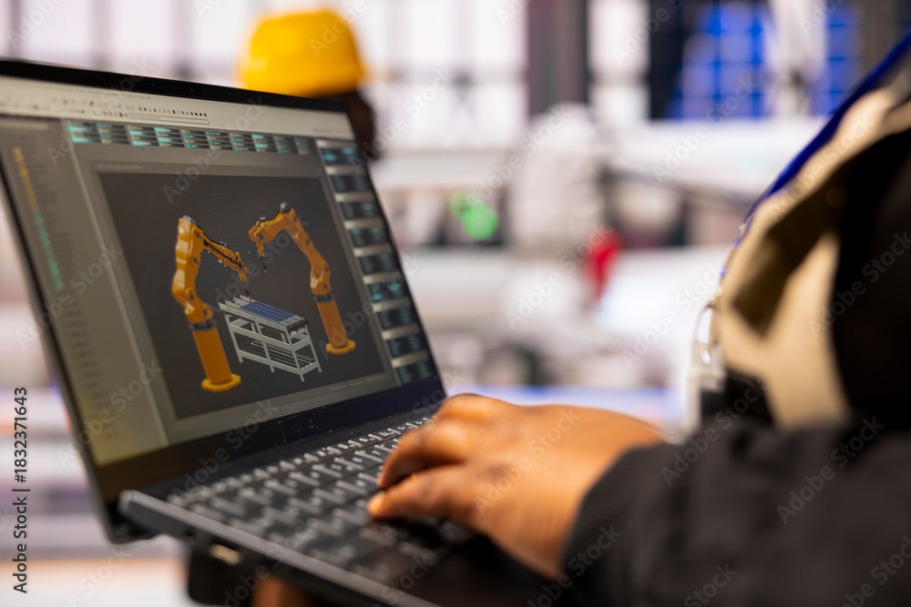 Fototapeta premium Factory automation expert supervises autonomous industrial plant, optimizing production line speed and robotic arm precision in manufacturing. Professional engineer upgrading industry 4.0 software.