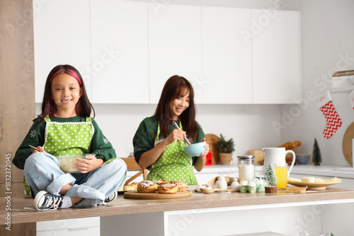 little Asian girl with her ...