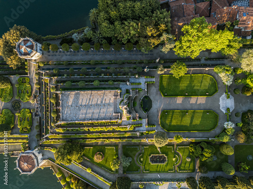 High-angle drone view directly over the elaborate, geometric Italianate terraced gardens (Teatro Massimo) and baroque architecture on Isola Bella, one of the Borromean Islands