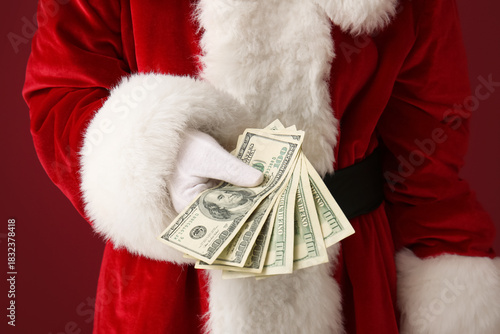 Santa Claus holding money o...