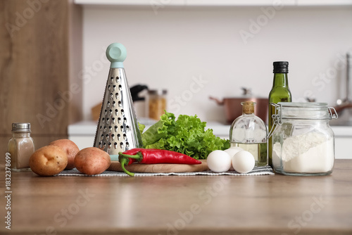 Grater with vegetables, egg...
