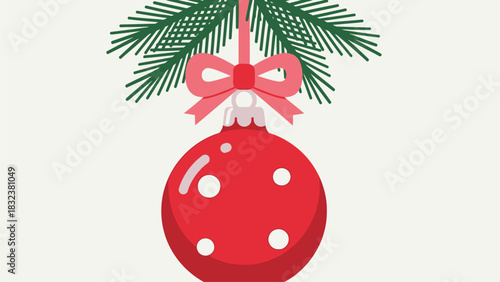 Red Christmas ornament with pine branches and a pink bow, a festive holiday decoration
