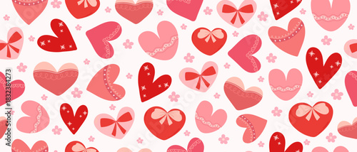 Seamless pattern with hand-drawn red and pink hearts with small flowers. Design for Valentine's Day, weddings, love, and romance.