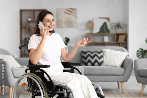 Young woman in wheelchair t...