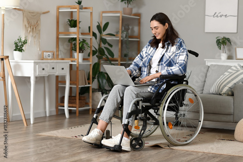 Young woman in wheelchair u...