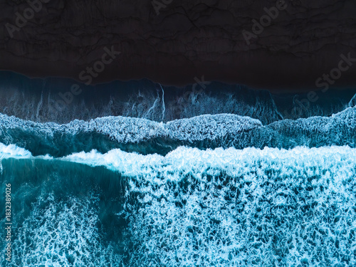 Black sand beach with crashing waves Atlantic ocean, Serene and tranquil landscape, Black sand of volcanic origin aerial view