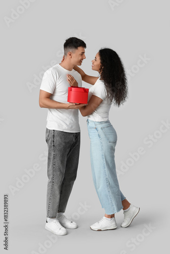 Loving young couple with gi...