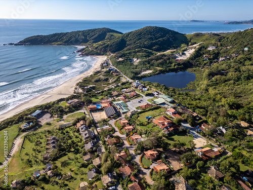 Aerial view of lake, forest and beach