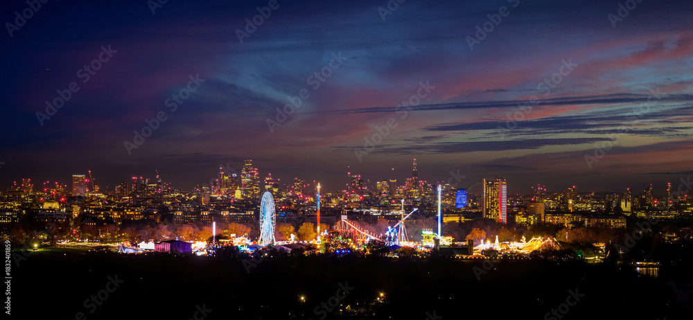 Naklejka premium London Skyline and Christmas Fair in Hyde Park at Twilight