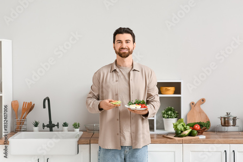 Handsome man holding plate ...
