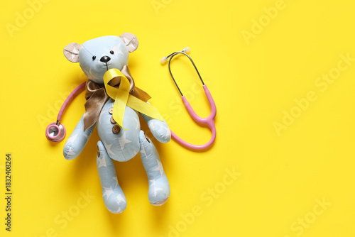 Yellow ribbon, teddy bear a...
