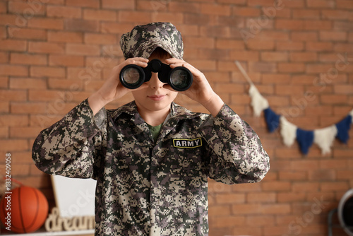 Teenage soldier looking thr...