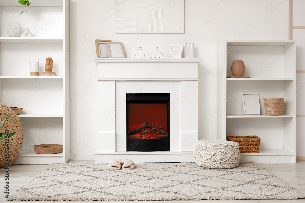 Fototapeta premium Interior of living room with shelf units, fireplace and slippers on carpet