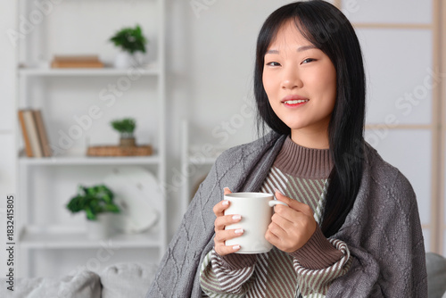 Young Asian woman with grey...