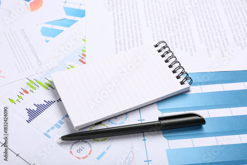 Notebook with pen, many bus...