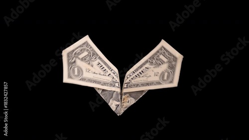 Origami flying butterfly dollar bill with clear alpha channel background.