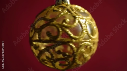 Ornament Suspended Against a Red Backdrop