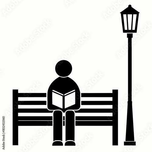 Serene Moment of Reading: A silhouette figure finds solace in reading a book on a park bench. Beside it, a classic street lamp provides a gentle ambiance.