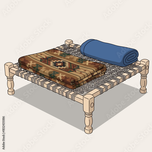 Traditional woven bed with patterned blanket and rolled blue covering