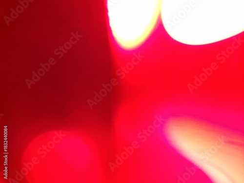 Vibrant Abstract Red Background with Bright Yellow and White Luminous Streaks, Bokeh Light Effects, and Smooth Color Gradient Texture