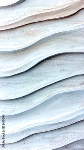 Close-up of a textured surface with a wave-like pattern, featuring light blue and beige colors.