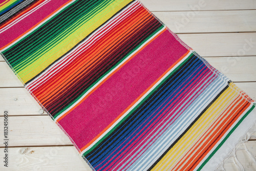 Colorful Mexican blankets in various colors and patterns for cultural and religious concepts.
