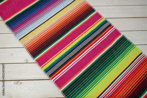 Colorful Mexican blankets in various colors and patterns for cultural and religious concepts.