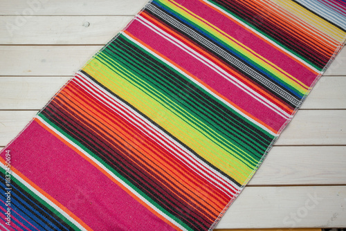 Colorful Mexican blankets in various colors and patterns for cultural and religious concepts.