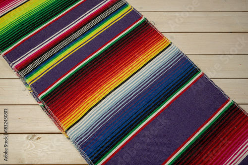 Colorful Mexican blankets in various colors and patterns for cultural and religious concepts.