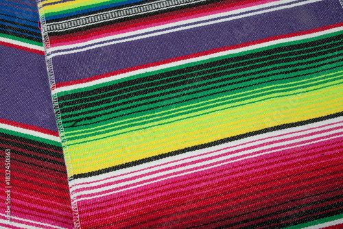Colorful Mexican blankets in various colors and patterns for cultural and religious concepts.