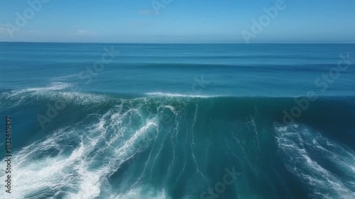 Ocean waves filmed with dolly-style camera movement, bright daylight, crisp and clear visuals with no shadows