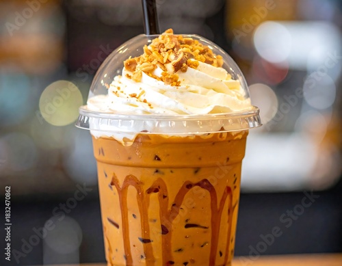 Refreshing iced beverage, whipped cream topping, caramelized sauce, plastic cup