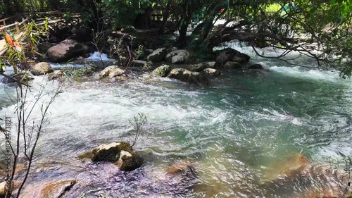 Superb view of summer: Slow motion of the fantastic Moot valley in Phong Nha National Park, Vietnam with the sound of a clear stream flowing through the peaceful tropical jungle