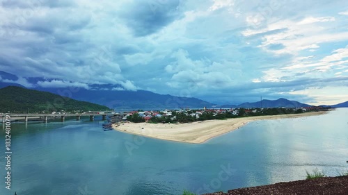 Timelapse of Lang Co Bay, Hue, Vietnam in the morning with a small fishing village peacefully below. It has beautiful lagoons