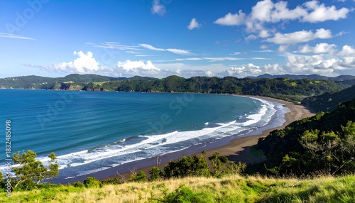Fototapeta Naklejka Na Ścianę i Meble -  A bright and vibrant ocean bay surrounded by lush green hills under a clear blue sky. 