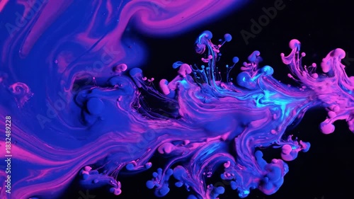 ﻿Seamless loop of slow-motion luminescent neon blue and magenta abstract liquid flowing organically against a dark background liquid flowing, digital, template