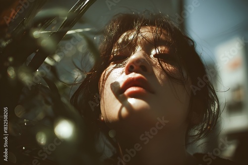 A close-up portrait of an Asian woman’s face in profile