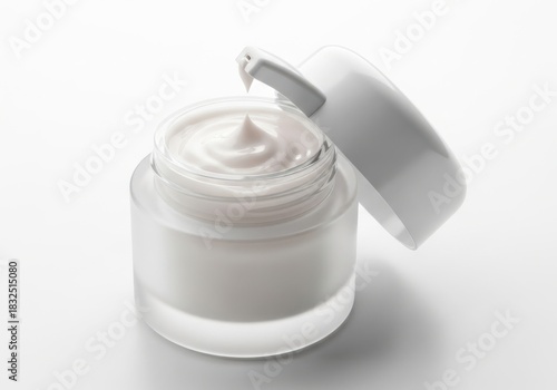 Cosmetic cream in clear jar with open lid isolated on white background