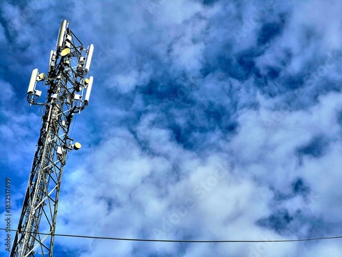 Cell Tower Against a Dramatic Blue Sky