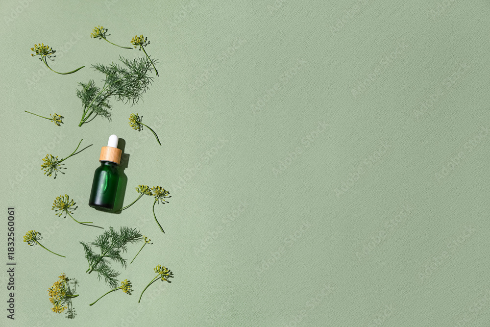 Obraz premium Composition with bottle of dill cosmetic product on green background
