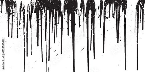 Black paint drips creating a grunge texture on a white background.