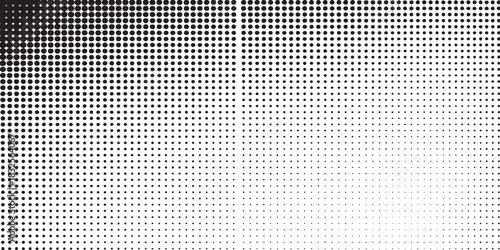 Monochrome halftone dot pattern with a gradient effect.