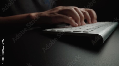 Close-up man typing on computer keyboard with hands and fingers. Macro soft focus dolly shot. Computer programming, text chat online messaging and online marketing business concept. Glean