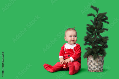 Cute little baby in Santa c...